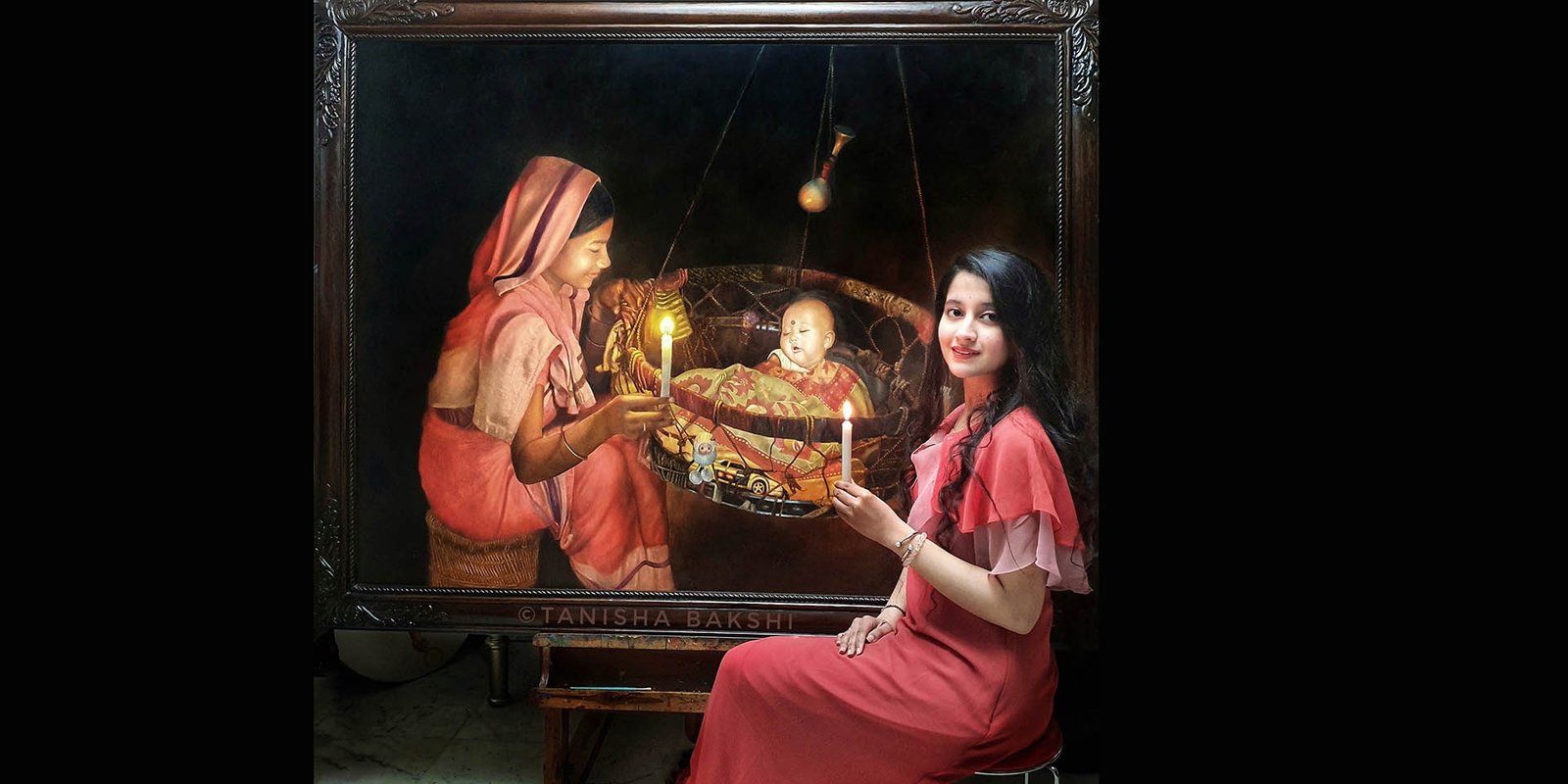 Tanisha Bakshi beside a mother and child artwork